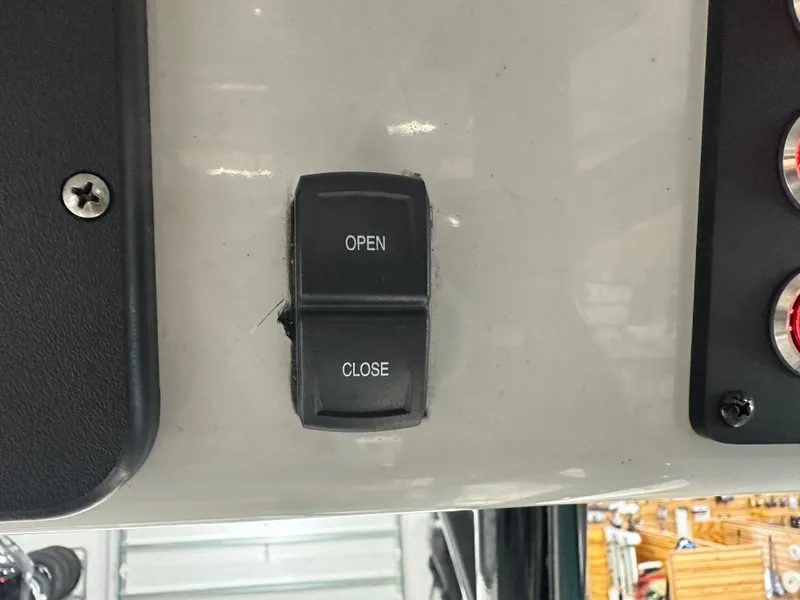 Slide: The Image of 2023 Sea Born FX 25 boat control panel with open/close switch. - 29