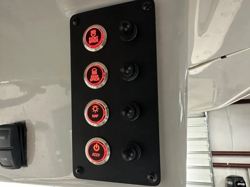 Slide: The Image of Control panel of 2023 Sea Born FX 25 boat with illuminated buttons. - 30