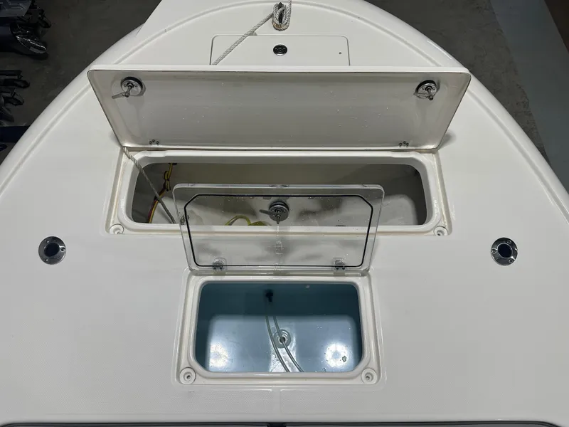 Slide: The Image of 2023 Sea Born FX 25 boat storage compartments and livewell. - 36