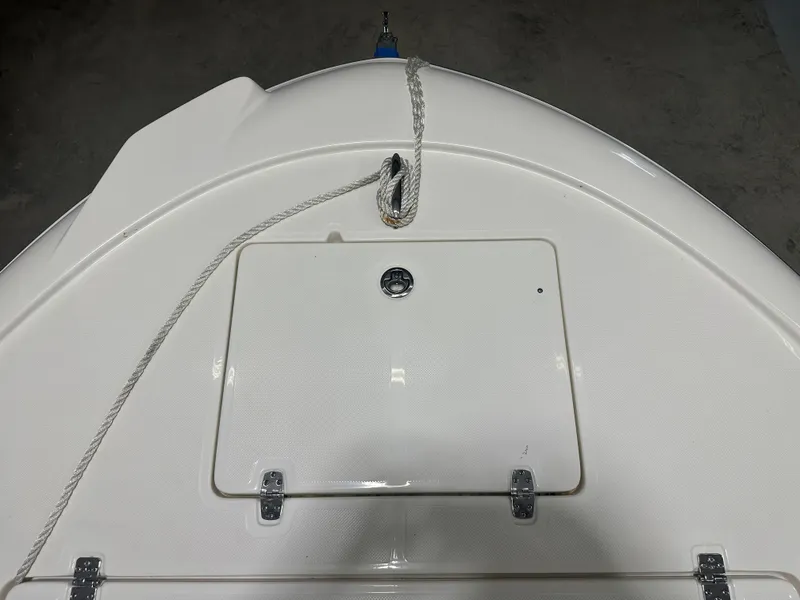 Slide: The Image of 2023 Sea Born FX 25 boat deck with storage hatch and rope. - 37