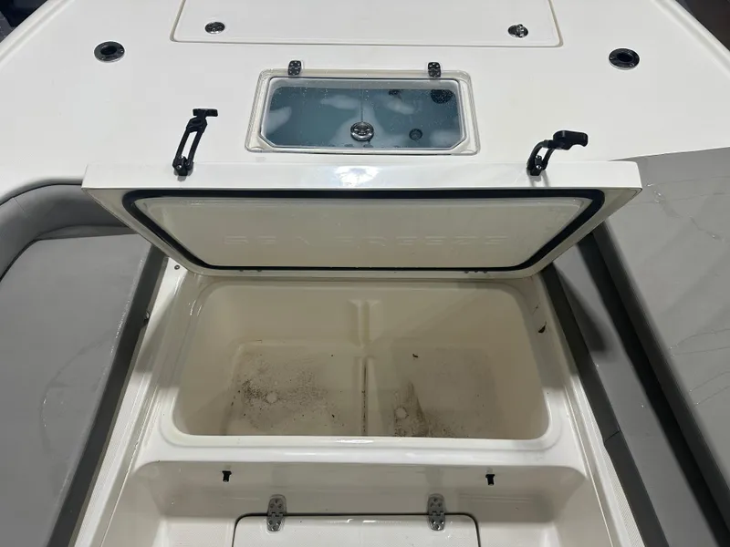 Slide: The Image of 2023 Sea Born FX 25 boat storage compartment with open lid, showcasing interior space. - 40