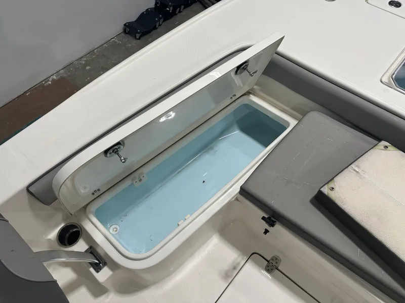 Slide: The Image of 2023 Sea Born FX 25 boat storage compartment with open lid, showcasing interior space. - 41