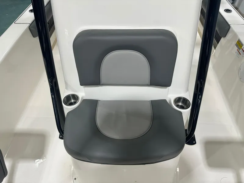 Slide: The Image of 2023 Sea Born FX 25 boat seat with cup holders, featuring gray and white upholstery. - 43