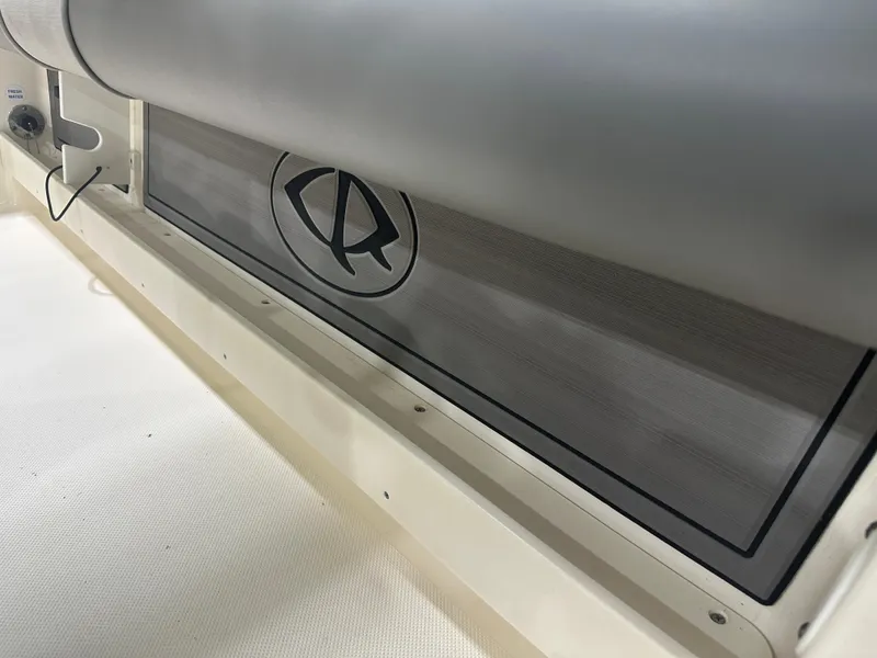 Slide: The Image of 2023 Sea Born FX 25 boat interior detail with logo and seating. - 49