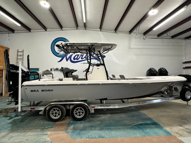 Slide: The Image of 2023 Sea Born FX 25 boat on trailer in indoor showroom. - 5