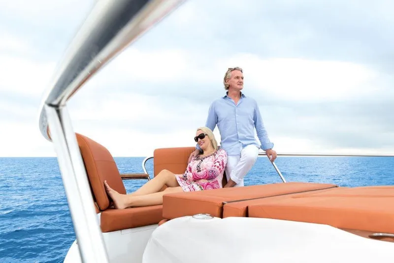 Slide: The Image of Couple relaxing on 2025 Sealine C430 yacht, enjoying ocean view. - 12