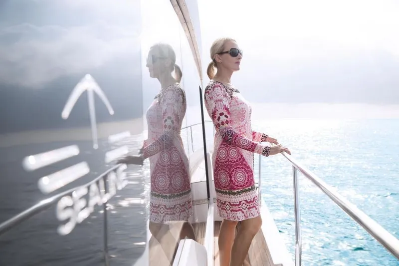 Slide: The Image of Woman enjoying ocean view on 2025 Sealine C430 yacht deck. - 14