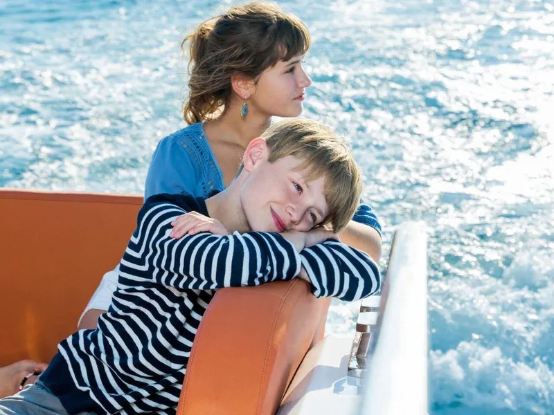 Slide: The Image of Children enjoying a boat ride on a 2025 Sealine C430 yacht. - 17