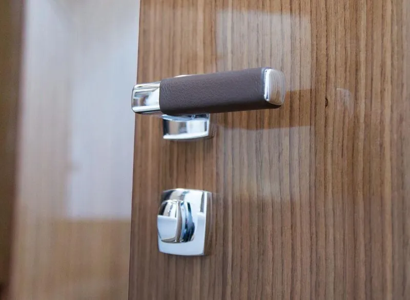 Slide: The Image of Chrome door handle on Sealine C430 yacht, 2025 model, with wood finish. - 30
