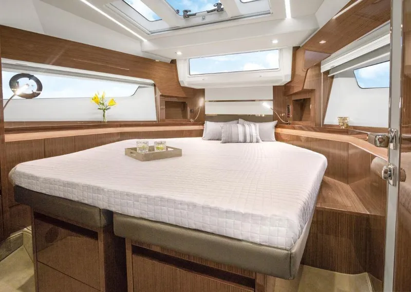 Slide: The Image of Luxurious interior of 2025 Sealine C430 yacht with elegant wood finish and skylight. - 34