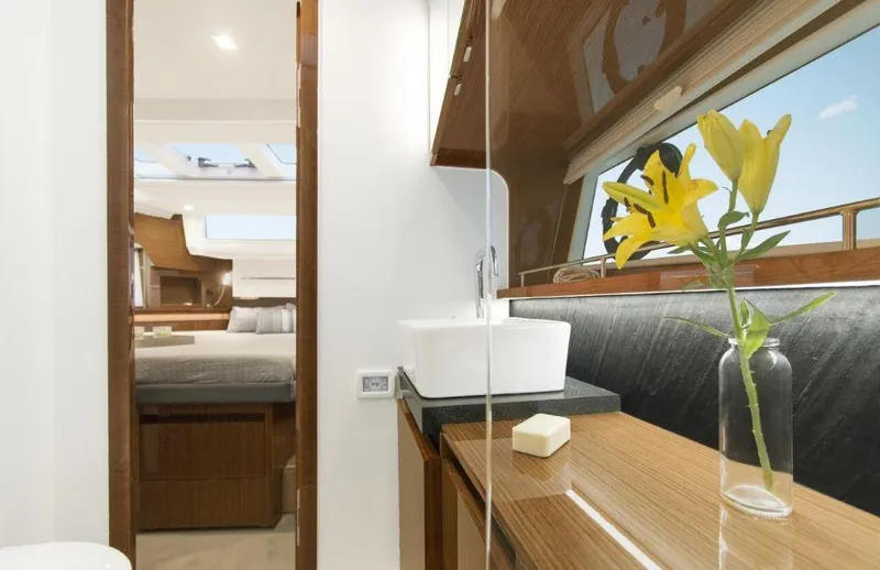 Slide: The Image of Luxurious interior of 2025 Sealine C430 yacht with elegant wood finishes and modern amenities. - 36