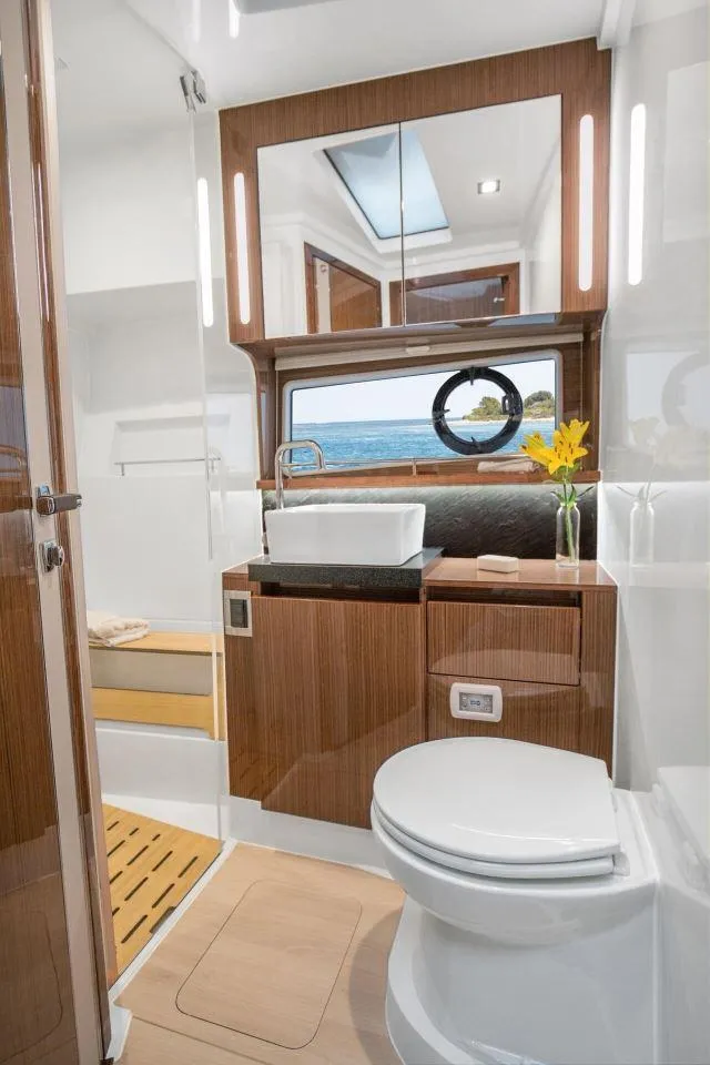 Slide: The Image of Luxurious bathroom in 2025 Sealine C430 yacht with modern fixtures and ocean view. - 39