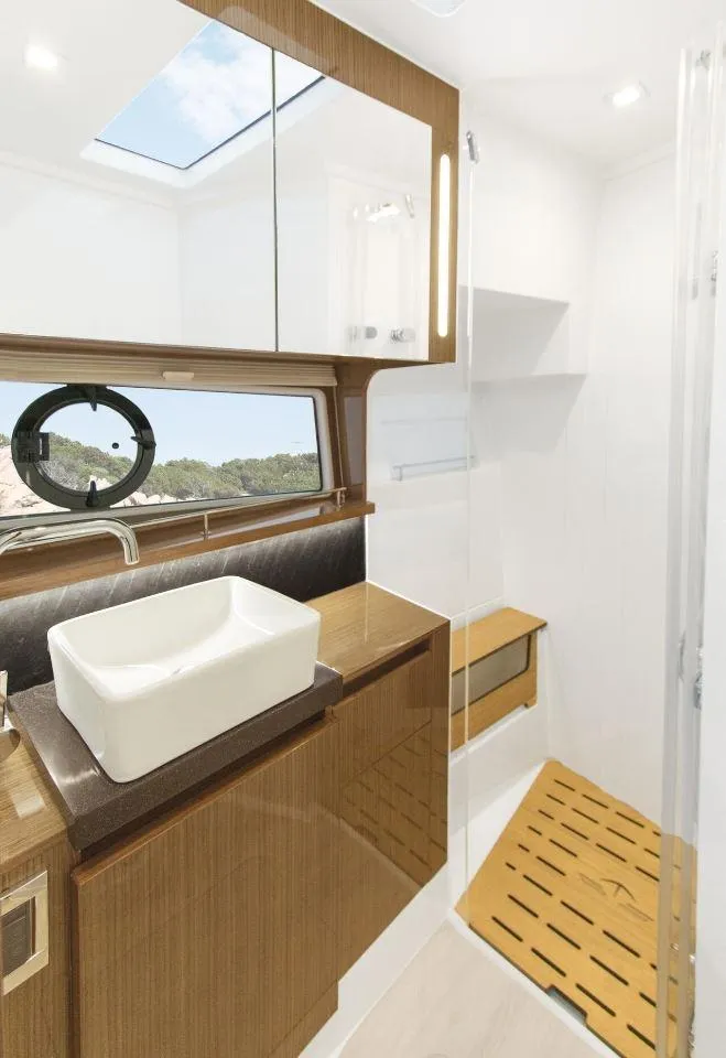 Slide: The Image of Luxurious bathroom in 2025 Sealine C430 yacht with modern fixtures and wooden accents. - 40