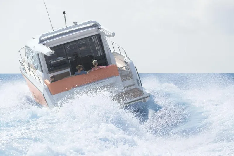 Slide: The Image of 2025 Sealine C430 yacht navigating through ocean waves. - 7