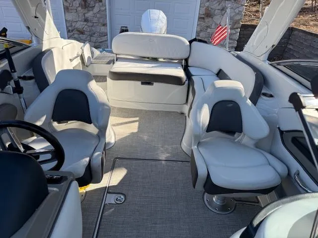 Slide: The Image of 2020 Crownline Eclipse E255 XS boat interior with plush seating and modern design. - 4