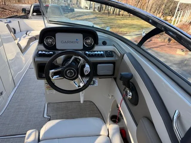 Slide: The Image of 2020 Crownline Eclipse E255 XS boat cockpit with Garmin navigation system. - 6