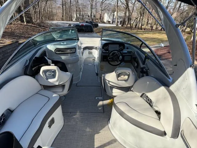 Slide: The Image of 2020 Crownline Eclipse E255 XS boat interior with seating and steering wheel. - 9