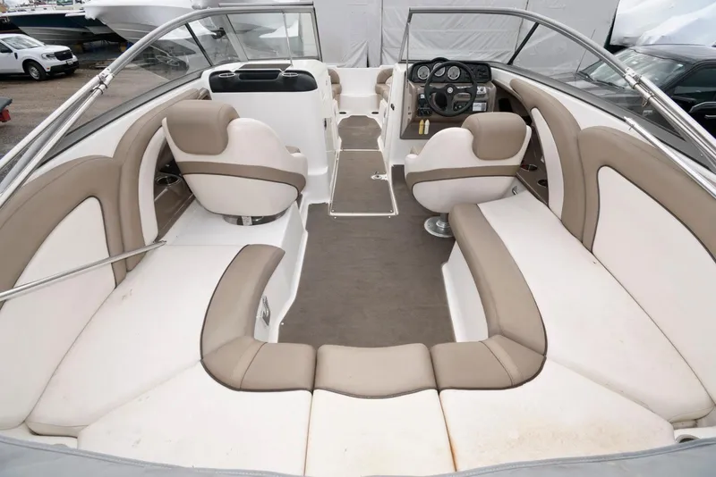 Slide: The Image of 2011 Yamaha Boats 242 Limited interior with spacious seating and modern dashboard. - 8