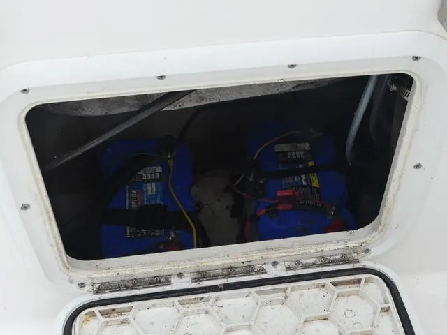 Slide: The Image of 2003 Pro Sports Pro Kat 2860 boat battery compartment with visible wiring. - 13