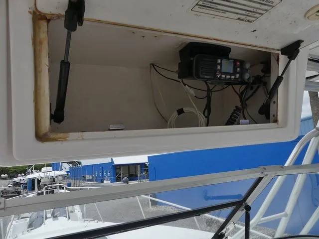 Slide: The Image of 2003 Pro Sports Pro Kat 2860 boat storage compartment with radio equipment. - 20