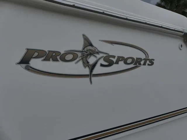 Slide: The Image of 2003 Pro Sports Pro Kat 2860 boat logo on white hull. - 25