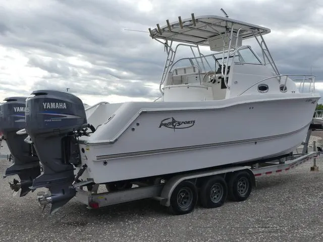 Slide: The Image of 2003 Pro Sports Pro Kat 2860 boat on trailer with Yamaha engines, under cloudy sky. - 6