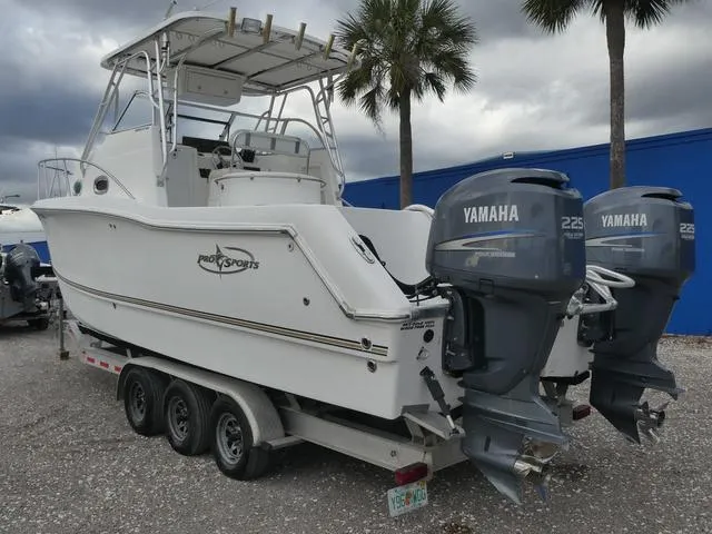 Slide: The Image of 2003 Pro Sports Pro Kat 2860 boat with twin Yamaha 225 engines on a trailer. - 8
