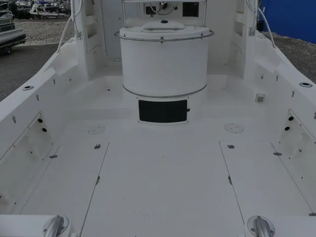 Slide: The Image of 2003 Pro Sports Pro Kat 2860 boat interior with spacious deck and seating area. - 9