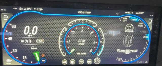 Slide: The Image of Dashboard of a 2021 Malibu 23 LSV boat showing speed, RPM, and surf settings. - 5