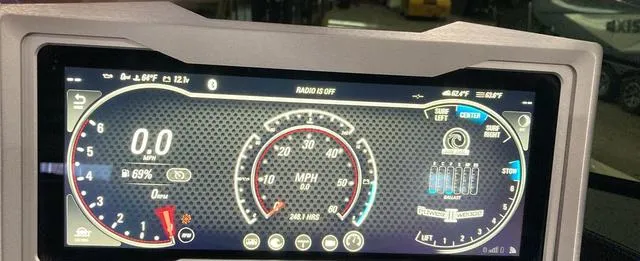 Slide: The Image of Dashboard of a 2021 Malibu M240 boat displaying speedometer and controls. - 9