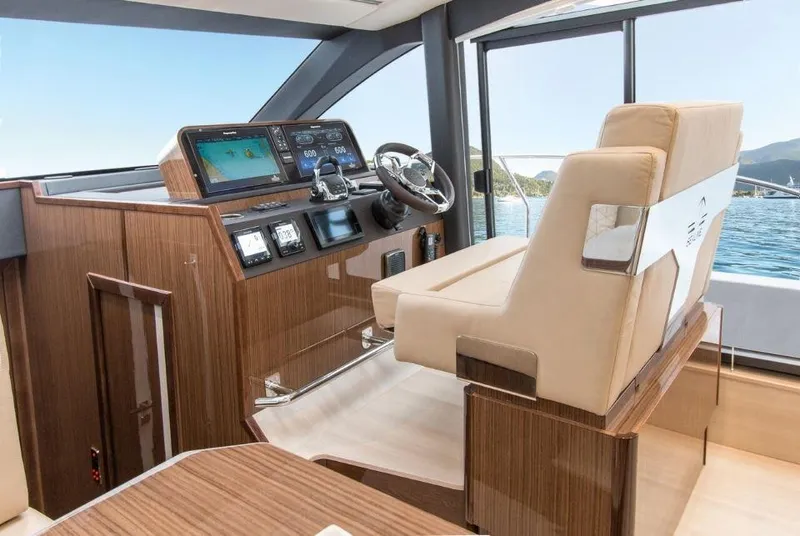 Slide: The Image of 2025 Sealine F430 yacht interior with modern helm and luxurious seating. - 13