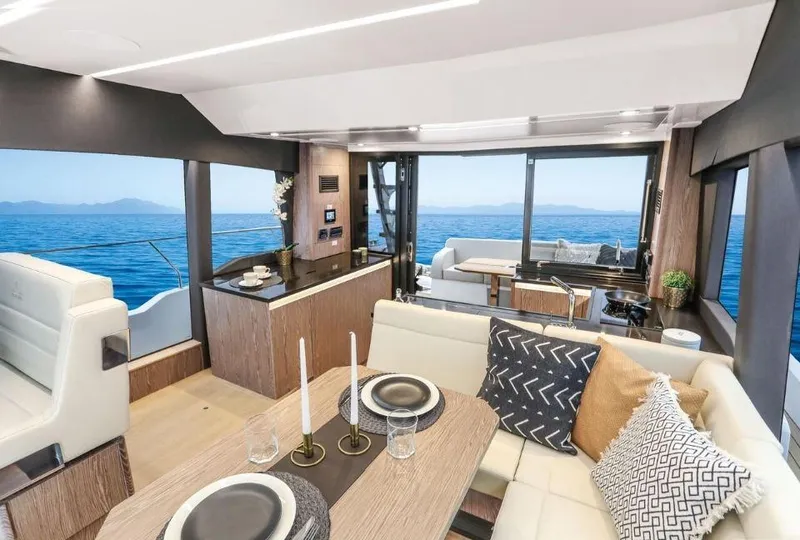 Slide: The Image of Luxurious interior of 2025 Sealine F430 yacht with elegant dining and ocean view. - 16