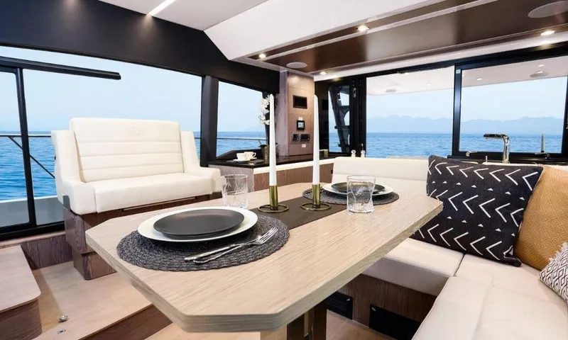 Slide: The Image of Luxurious interior of 2025 Sealine F430 yacht with elegant dining area and ocean view. - 17