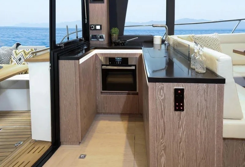 Slide: The Image of Modern kitchen interior of 2025 Sealine F430 yacht with ocean view. - 19