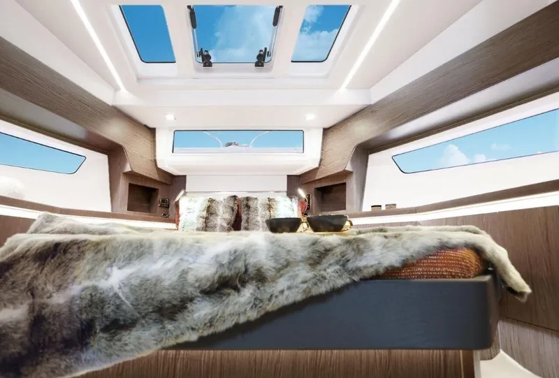 Slide: The Image of Luxurious interior of 2025 Sealine F430 yacht with skylights and plush bedding. - 24