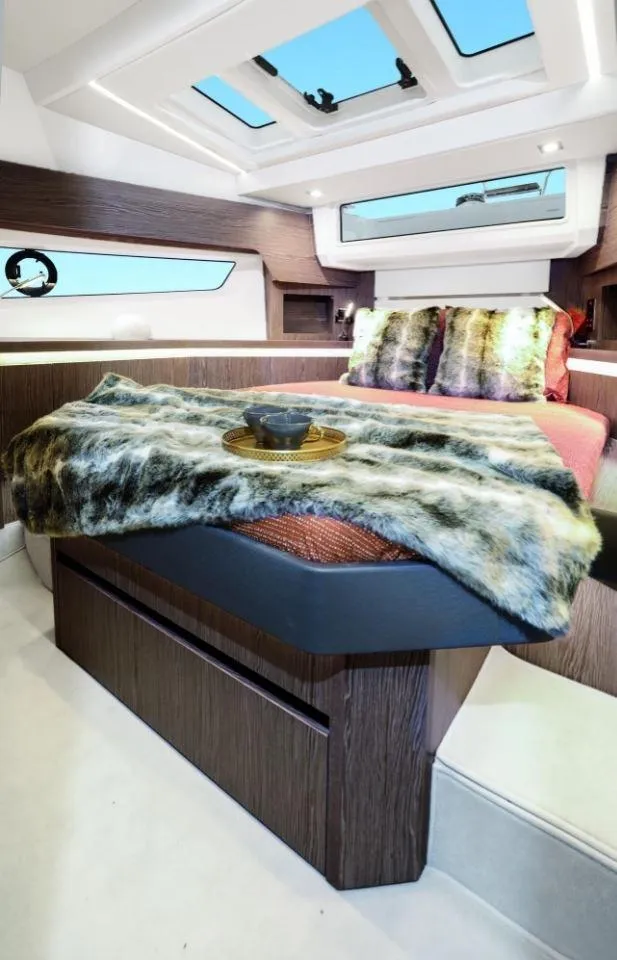 Slide: The Image of Luxurious interior of 2025 Sealine F430 yacht with modern bedding and skylights. - 25