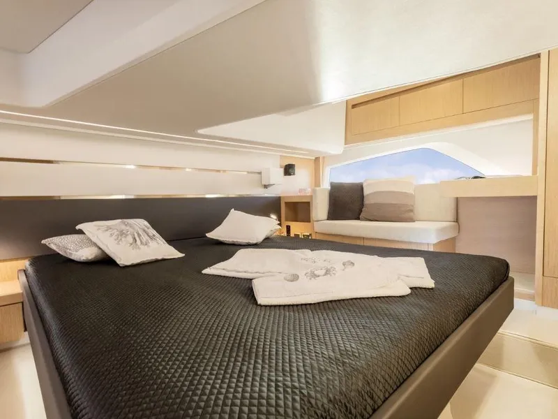 Slide: The Image of Luxurious interior of 2025 Sealine F430 yacht with elegant bedding and modern design. - 35