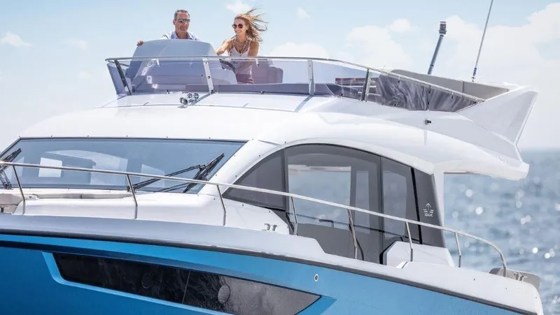 Slide: The Image of 2025 Sealine F430 yacht cruising on open water with passengers enjoying the view. - 6