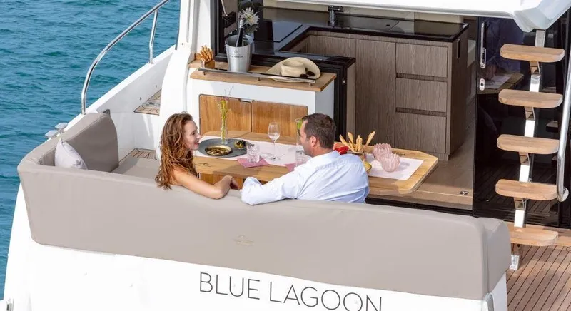 Slide: The Image of Couple relaxing on 2025 Sealine F430 yacht, enjoying a meal on "Blue Lagoon." - 8
