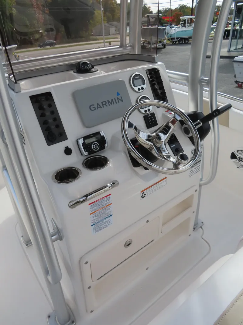Slide: The Image of 2018 Robalo R222 Center Console boat dashboard with Garmin navigation system. - 11