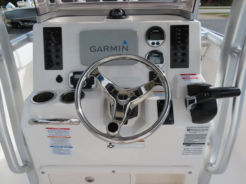Slide: The Image of 2018 Robalo R222 Center Console dashboard with Garmin navigation system and controls. - 13
