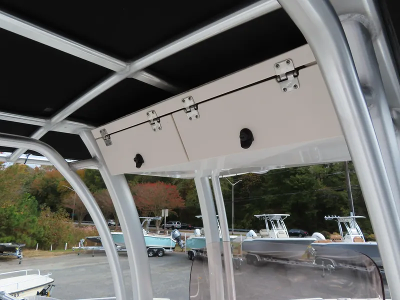 Slide: The Image of 2018 Robalo R222 Center Console boat with overhead storage compartment. - 14
