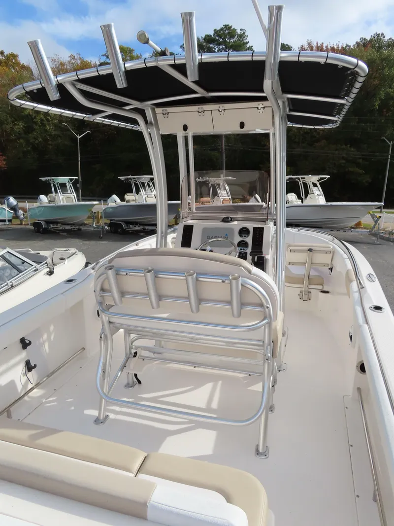 Slide: The Image of 2018 Robalo R222 Center Console boat with T-top and seating. - 16