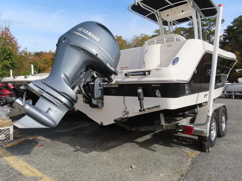 Slide: The Image of 2018 Robalo R222 Center Console boat with Yamaha outboard motor on trailer. - 2