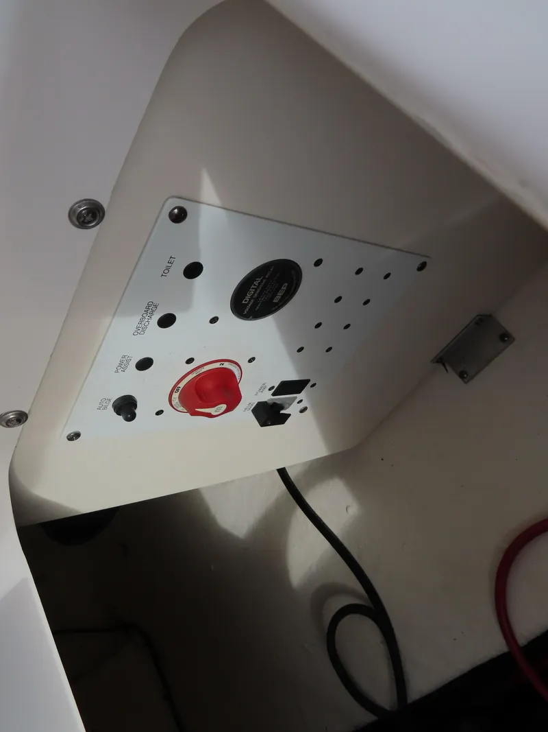 Slide: The Image of 2018 Robalo R222 Center Console control panel with switches and wiring. - 24