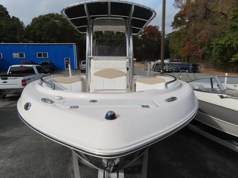 Slide: The Image of 2018 Robalo R222 Center Console boat, white exterior, parked outdoors. - 4