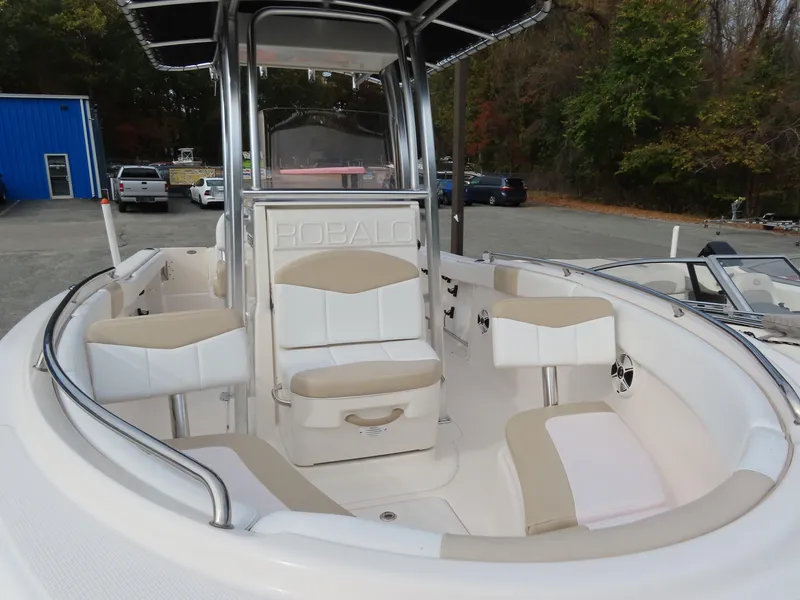 Slide: The Image of 2018 Robalo R222 Center Console boat with spacious seating and sleek design. - 6