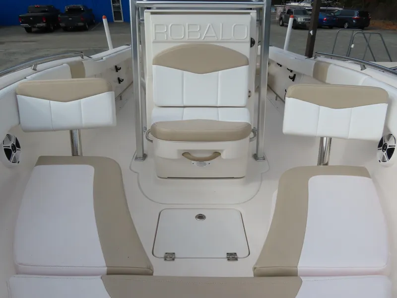 Slide: The Image of 2018 Robalo R222 Center Console boat interior with beige and white seating. - 7