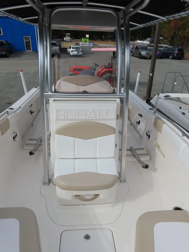Slide: The Image of 2018 Robalo R222 Center Console boat interior with seating and console view. - 8