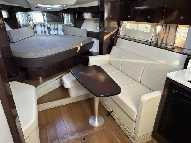 Slide: The Image of Interior of 2017 Sea Ray Sundancer 350 Coupe with cozy seating and modern design. - 12